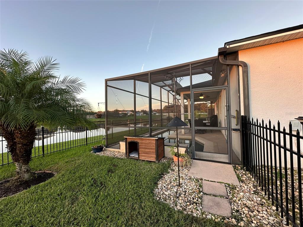 3008 Boat Lift Road Kissimmee, FL 34746 - Photo 43 of 56 a view of a porch with chairs and backyard