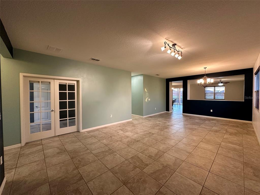 3008 Boat Lift Road Kissimmee, FL 34746 - Photo 10 of 56 a view of empty room with windows and ceiling fan