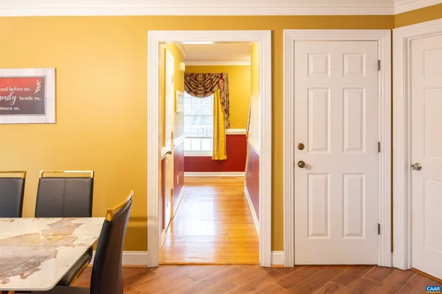 a bathroom with a sink a toilet a mirror and shower curtain