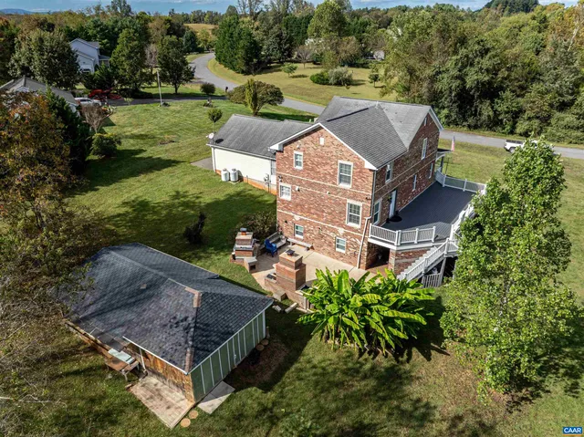 an aerial view of a house with a garden