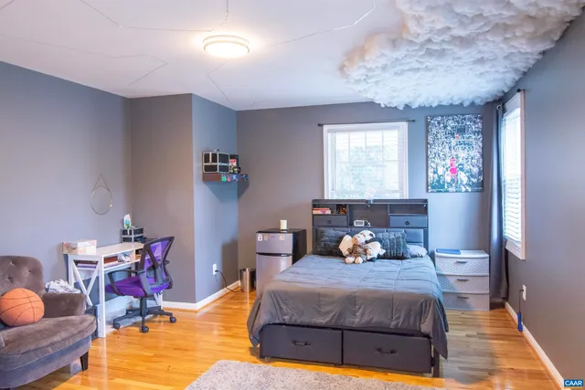 a bedroom with a bed and a table in it