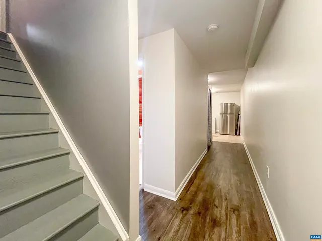 a workspace with furniture and wooden floor