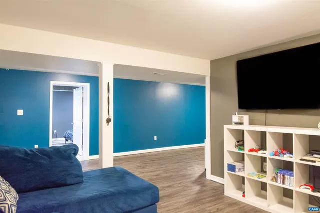 a room with furniture and wooden floor