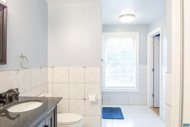 a backyard of a house with trees and entertaining space