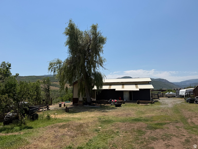 785 Hardscrabble Road Morgan, UT 84050 - Photo 7 of 16 Metal-sided outbuilding with a white corrugated metal roof