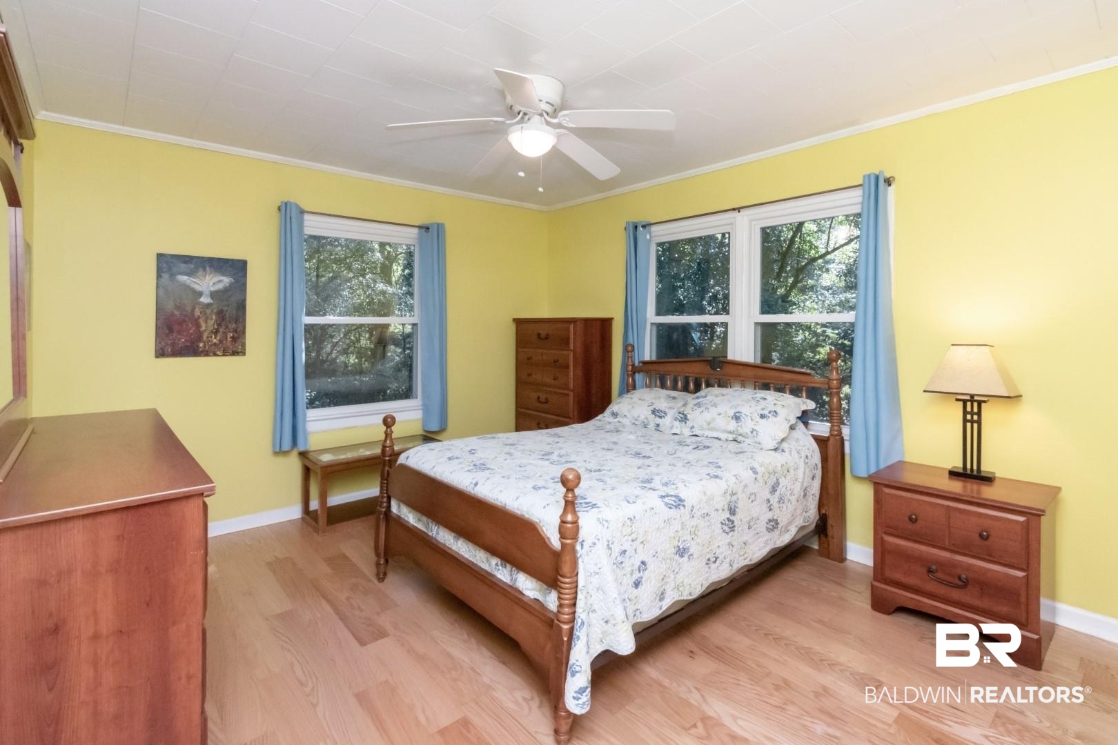 1321 Rainbow Drive West Mobile, AL 36693 - Photo 25 of 48 Bedroom featuring crown molding, light hardwood / wood-style flooring, multiple windows, and ceiling fan