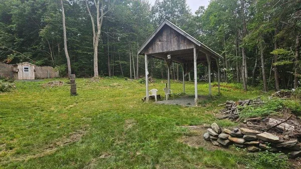 a backyard of a house with plants and outdoor space