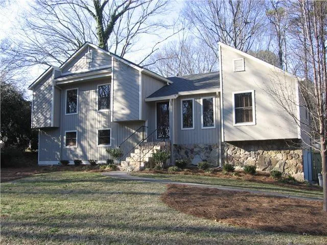 a front view of a house with a yard