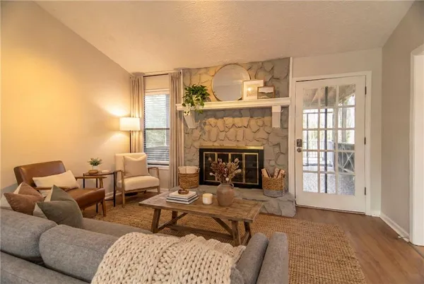 a living room with furniture and a fireplace