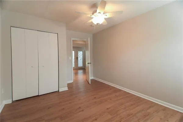 a view of an empty room with a fan