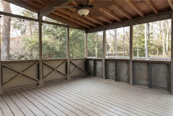a view of a balcony with wooden floor