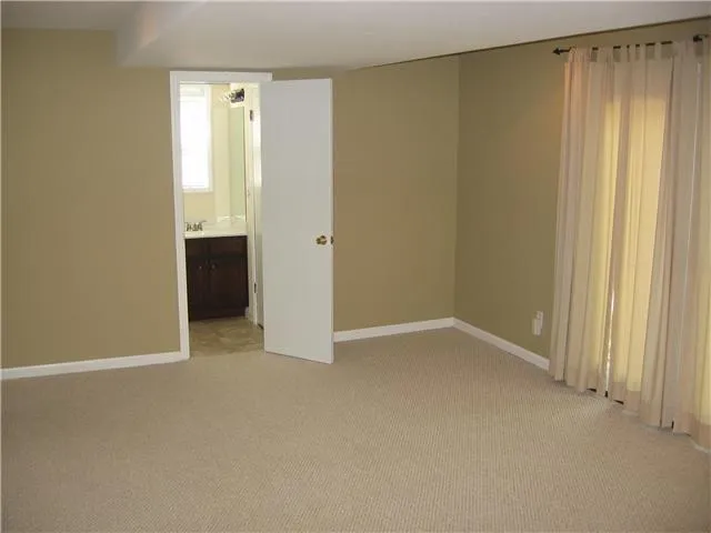 a view of an empty room and a window