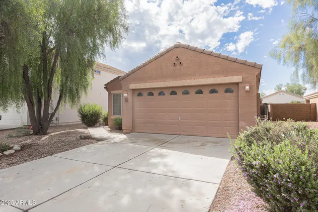 a front view of a house with a garage