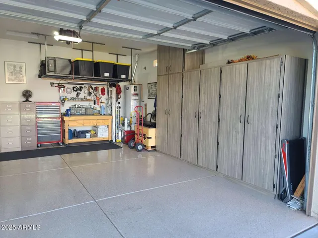 a outdoor space with the couches and dining table with the garden view