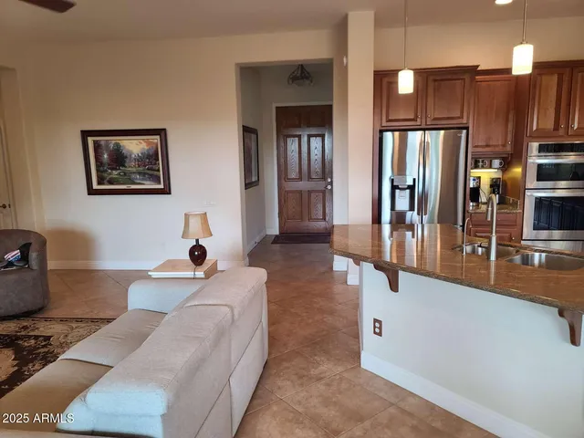 a living room with fireplace furniture and a lamp