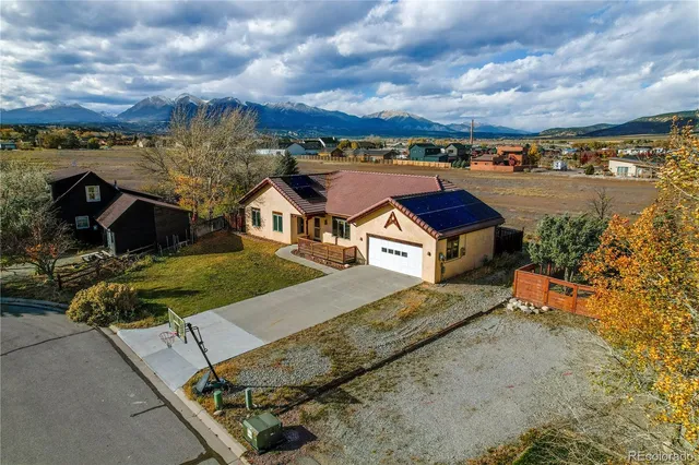 an aerial view of residential houses with outdoor space