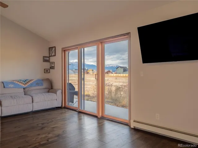 a workspace with wooden floor and a window