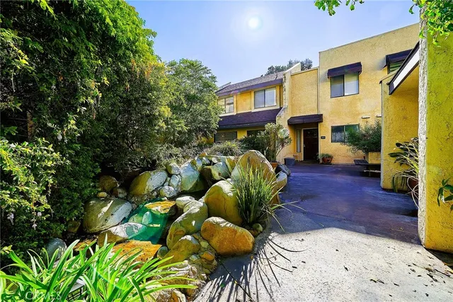 a view of a porch with furniture and a potted plant