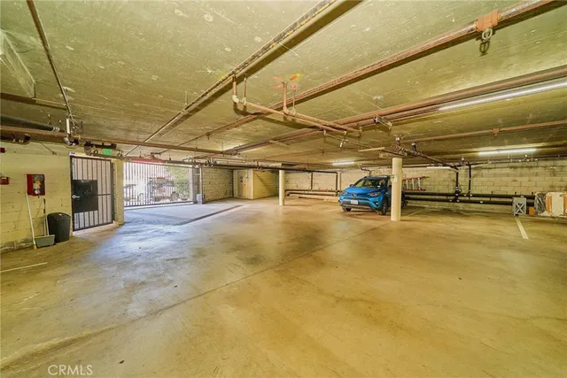 a view of a garage with wooden cabinets