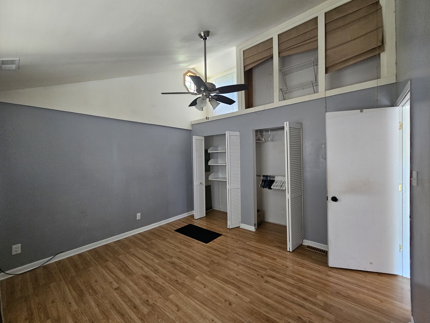 10N827 Hawthorne Street Elgin, IL 60123 - Photo 9 of 14 wooden floor in an empty room with a window