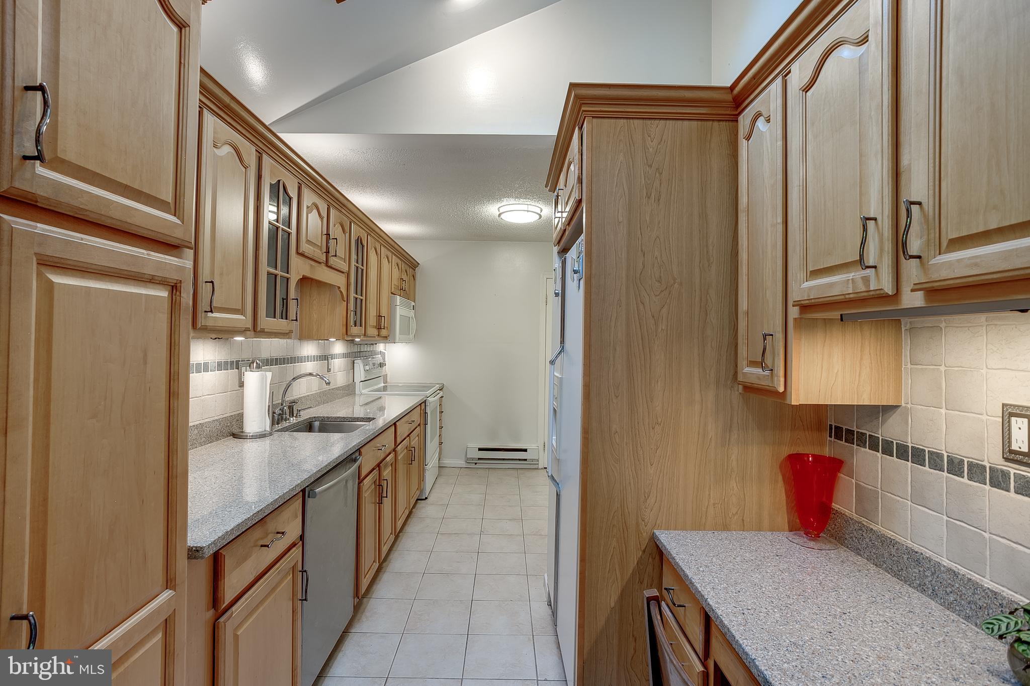 123 Wyndmere Road Marlton, NJ 08053 - Photo 11 of 31 a kitchen with granite countertop a sink and stove