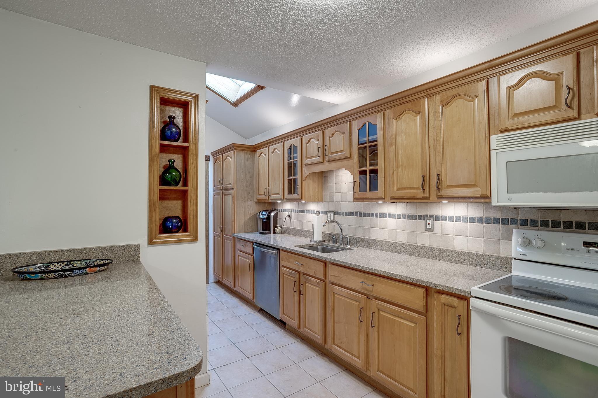 123 Wyndmere Road Marlton, NJ 08053 - Photo 13 of 31 a kitchen with stainless steel appliances granite countertop a sink stove and cabinets