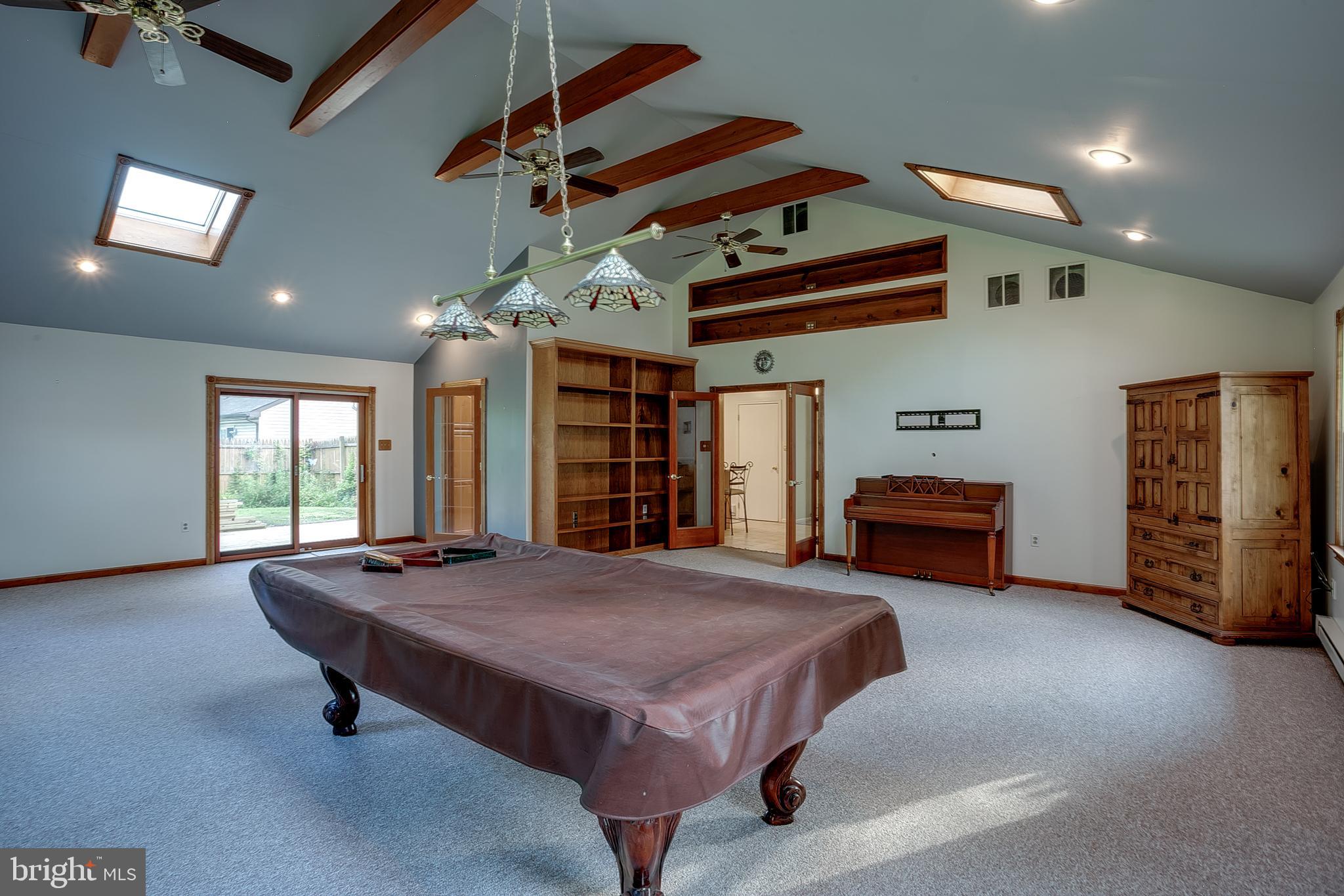 123 Wyndmere Road Marlton, NJ 08053 - Photo 17 of 31 a spacious bedroom with a bed and a chandelier