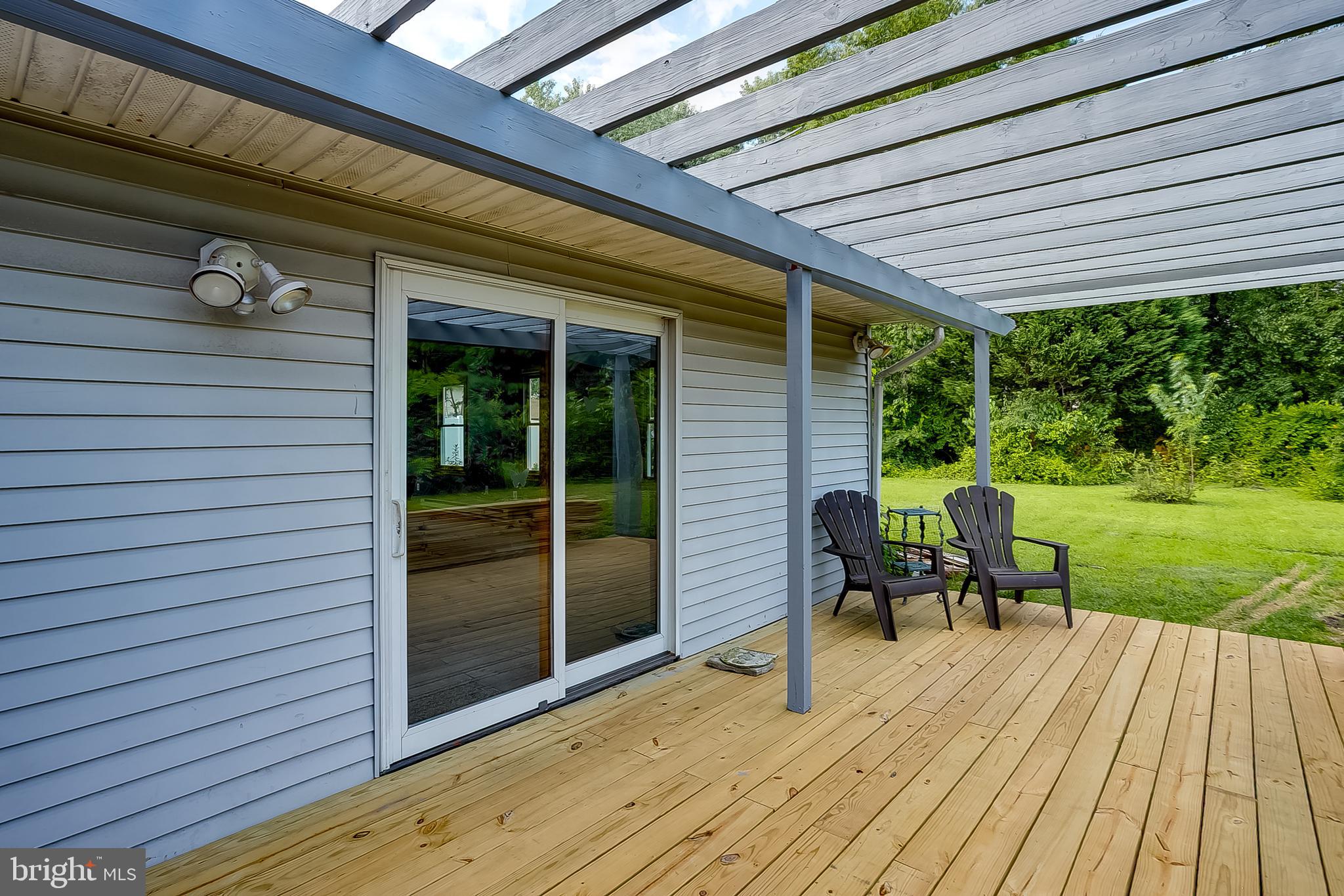 123 Wyndmere Road Marlton, NJ 08053 - Photo 27 of 31 a view of a patio with table and chairs with wooden floor and fence