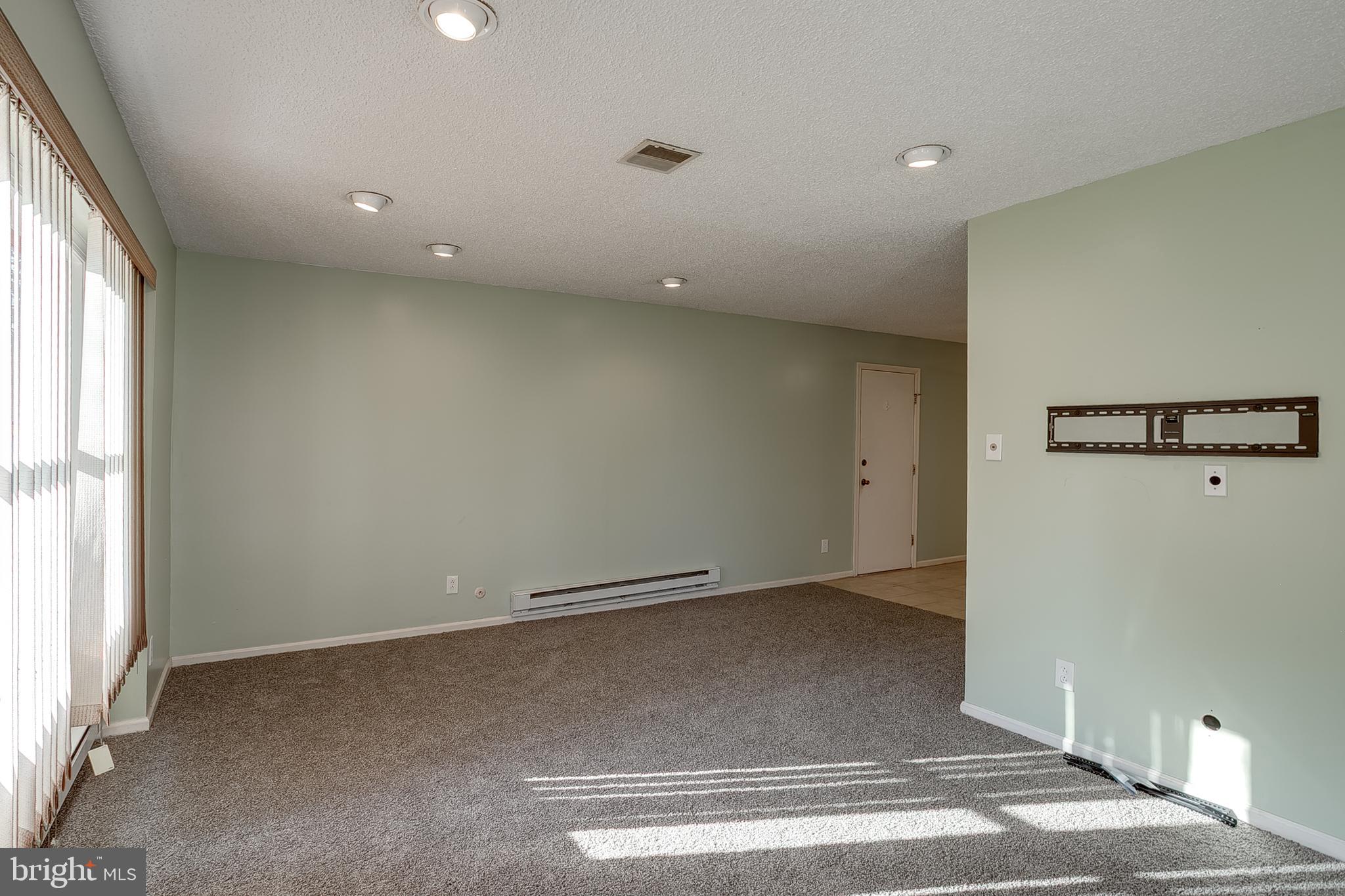 123 Wyndmere Road Marlton, NJ 08053 - Photo 5 of 31 an empty room with a empty space and windows