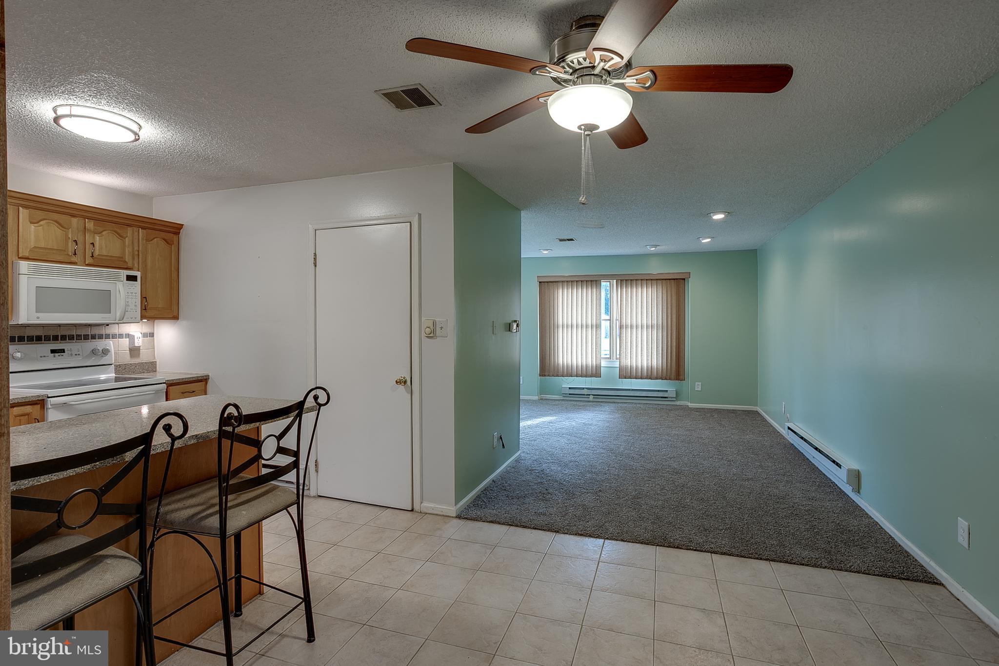 123 Wyndmere Road Marlton, NJ 08053 - Photo 7 of 31 a view of a livingroom with a kitchen