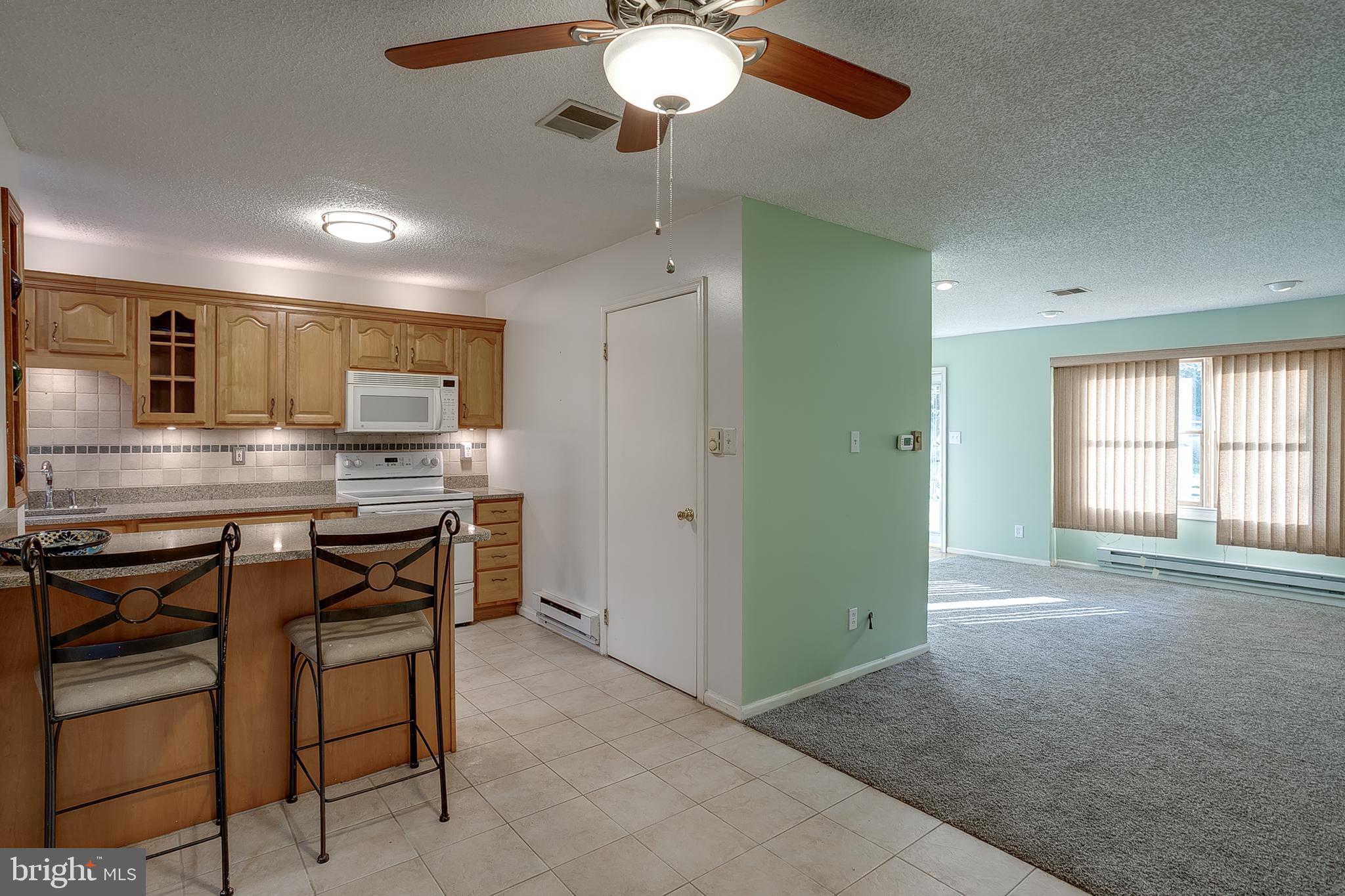123 Wyndmere Road Marlton, NJ 08053 - Photo 8 of 31 a kitchen with kitchen island granite countertop appliances cabinets and furniture