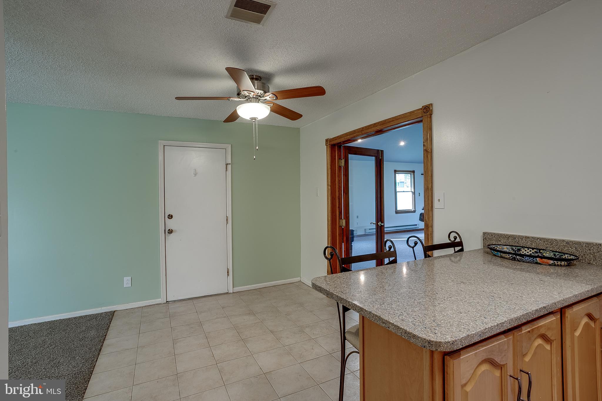 123 Wyndmere Road Marlton, NJ 08053 - Photo 9 of 31 a kitchen with a table a sink and cabinet