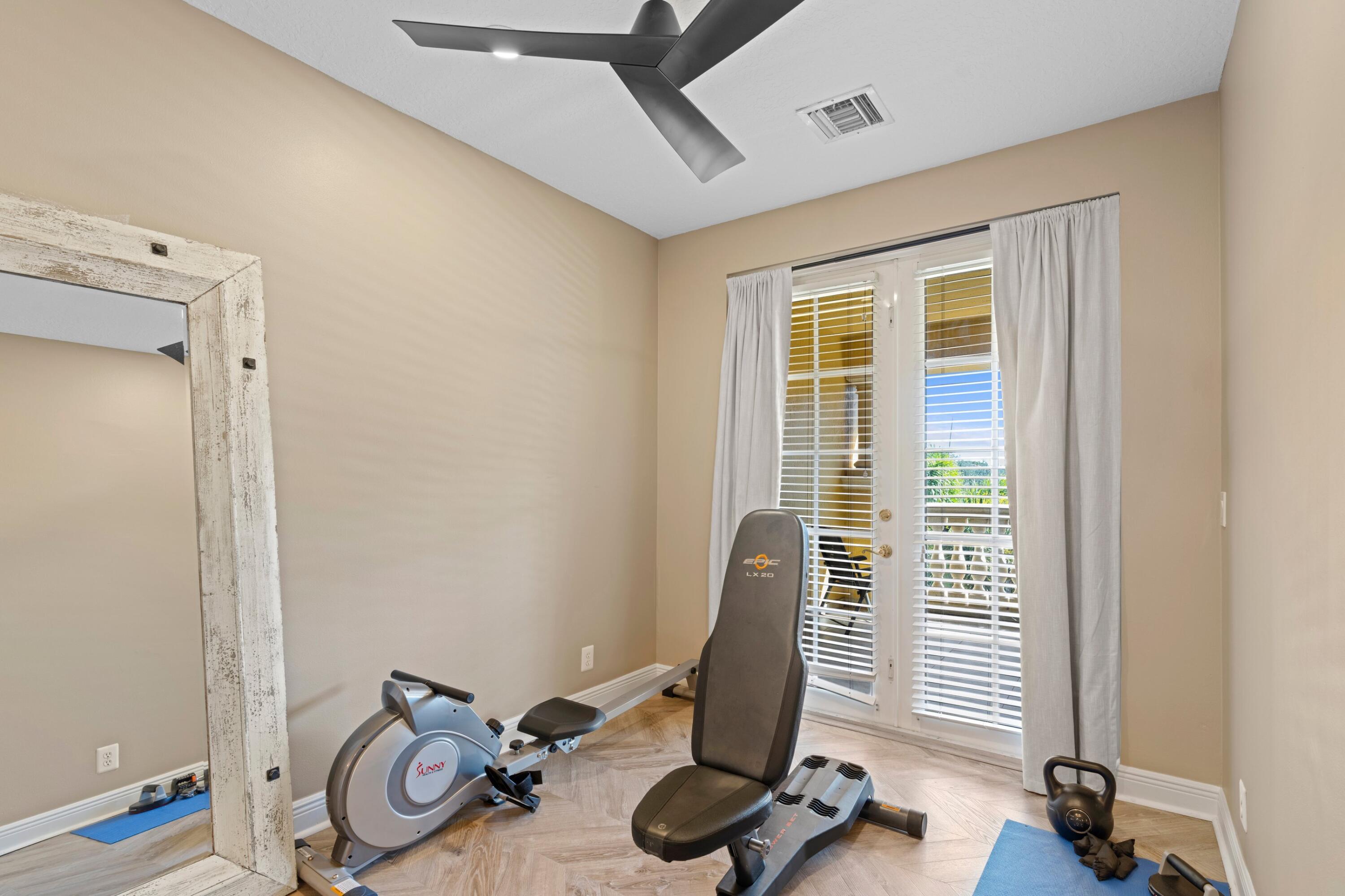 230 Northeast 69th Circle Boca Raton, FL 33487 - Photo 13 of 49 a view of a room with gym equipment
