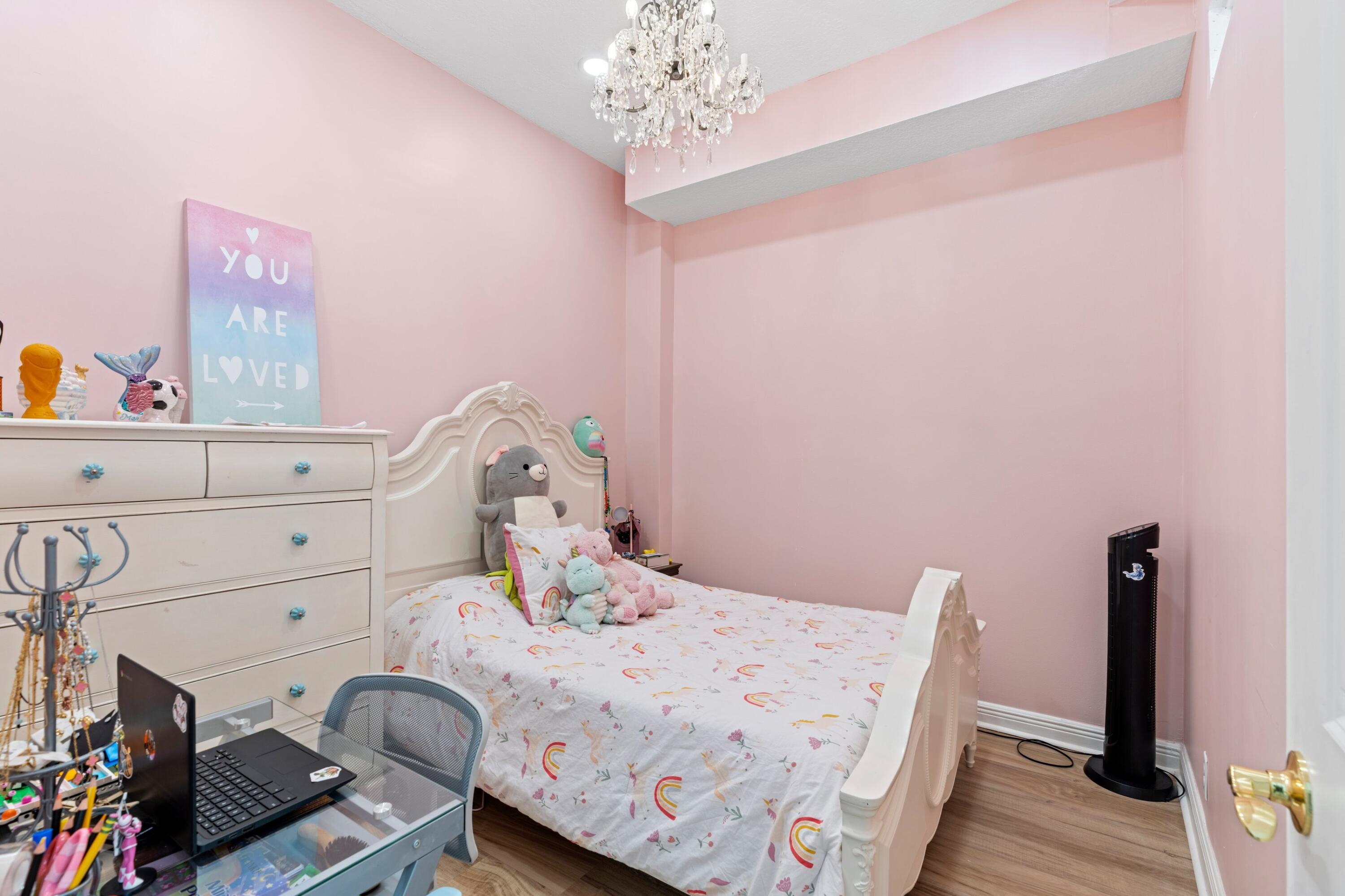 230 Northeast 69th Circle Boca Raton, FL 33487 - Photo 19 of 49 a bedroom with a bed and wooden floor