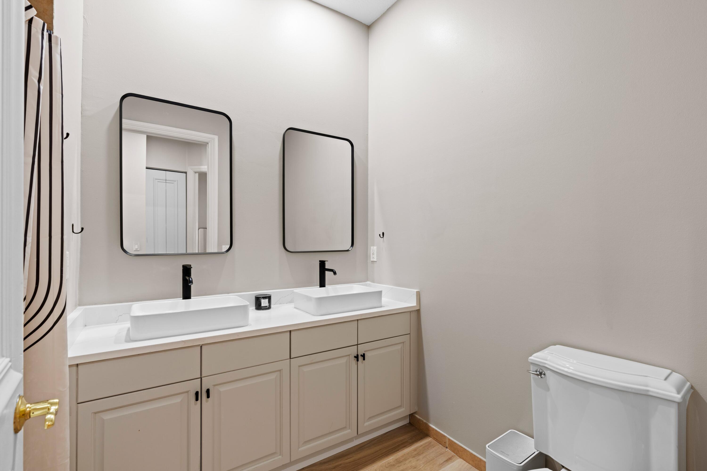 230 Northeast 69th Circle Boca Raton, FL 33487 - Photo 20 of 49 a bathroom with 2 sink and a toilet