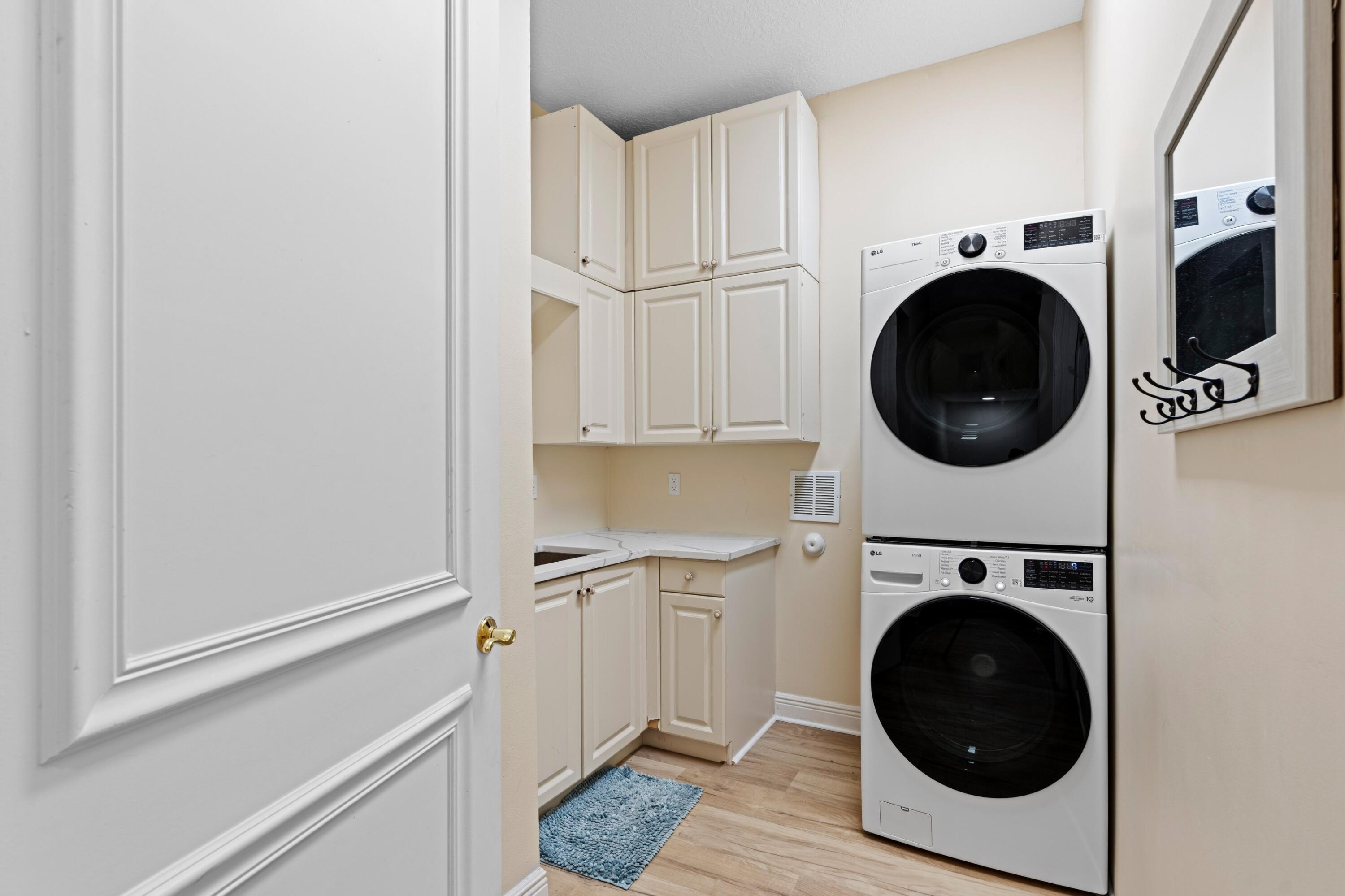 230 Northeast 69th Circle Boca Raton, FL 33487 - Photo 26 of 49 a utility room with sink dryer and washer