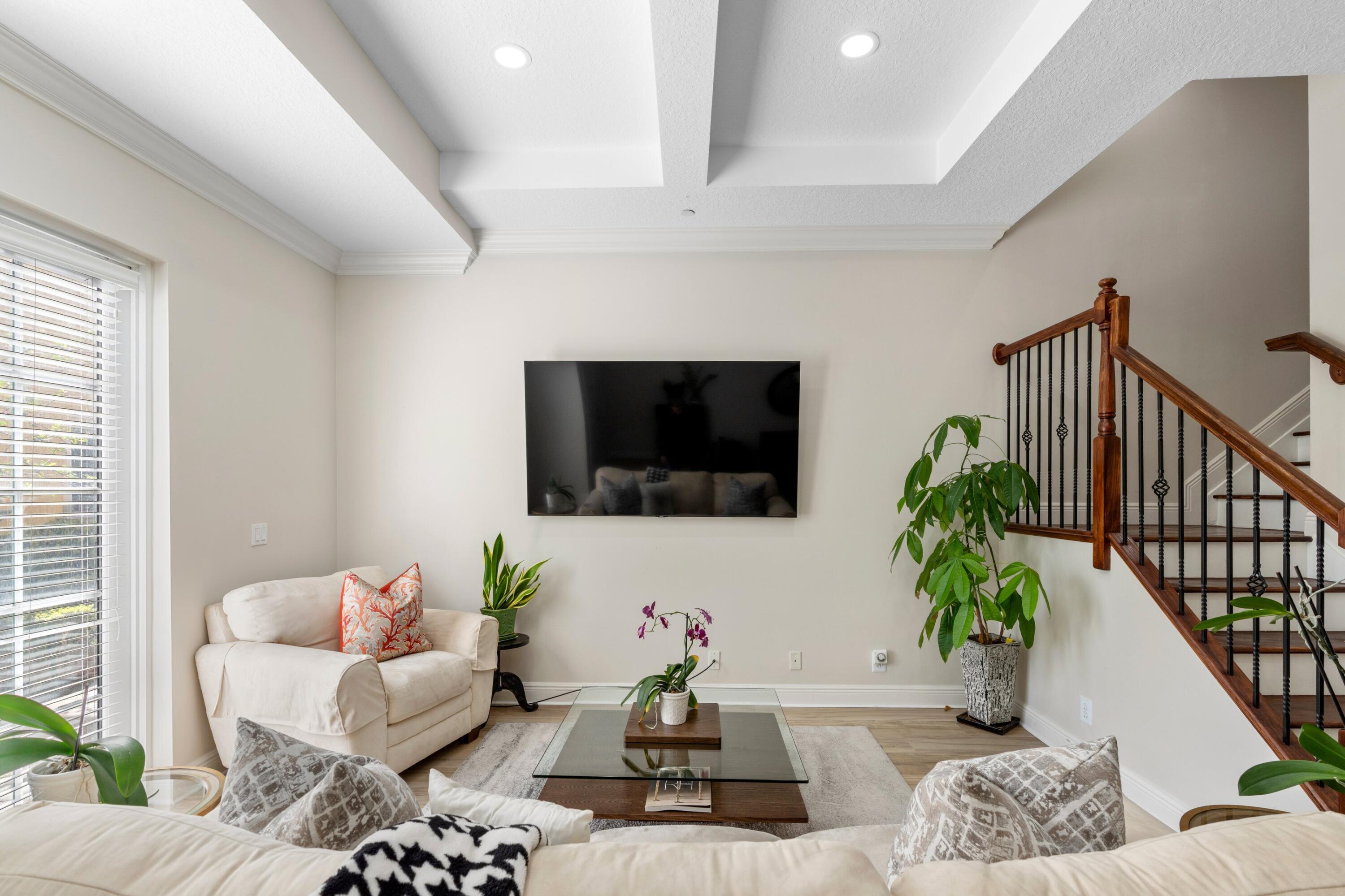 230 Northeast 69th Circle Boca Raton, FL 33487 - Photo 5 of 49 a living room with furniture and a potted plant