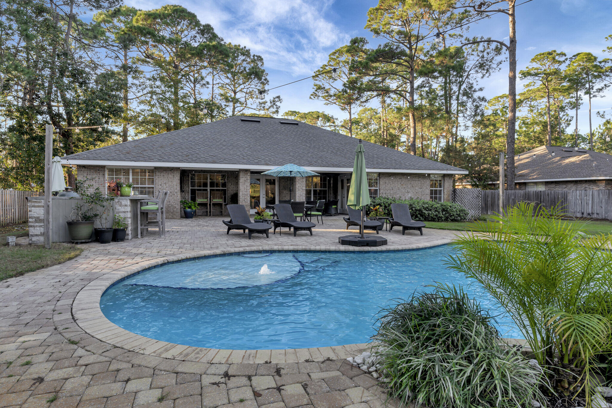 66 Driftwood Point Road Santa Rosa Beach, FL 32459 - Photo 1 of 72 a front view of a house with swimming pool and porch