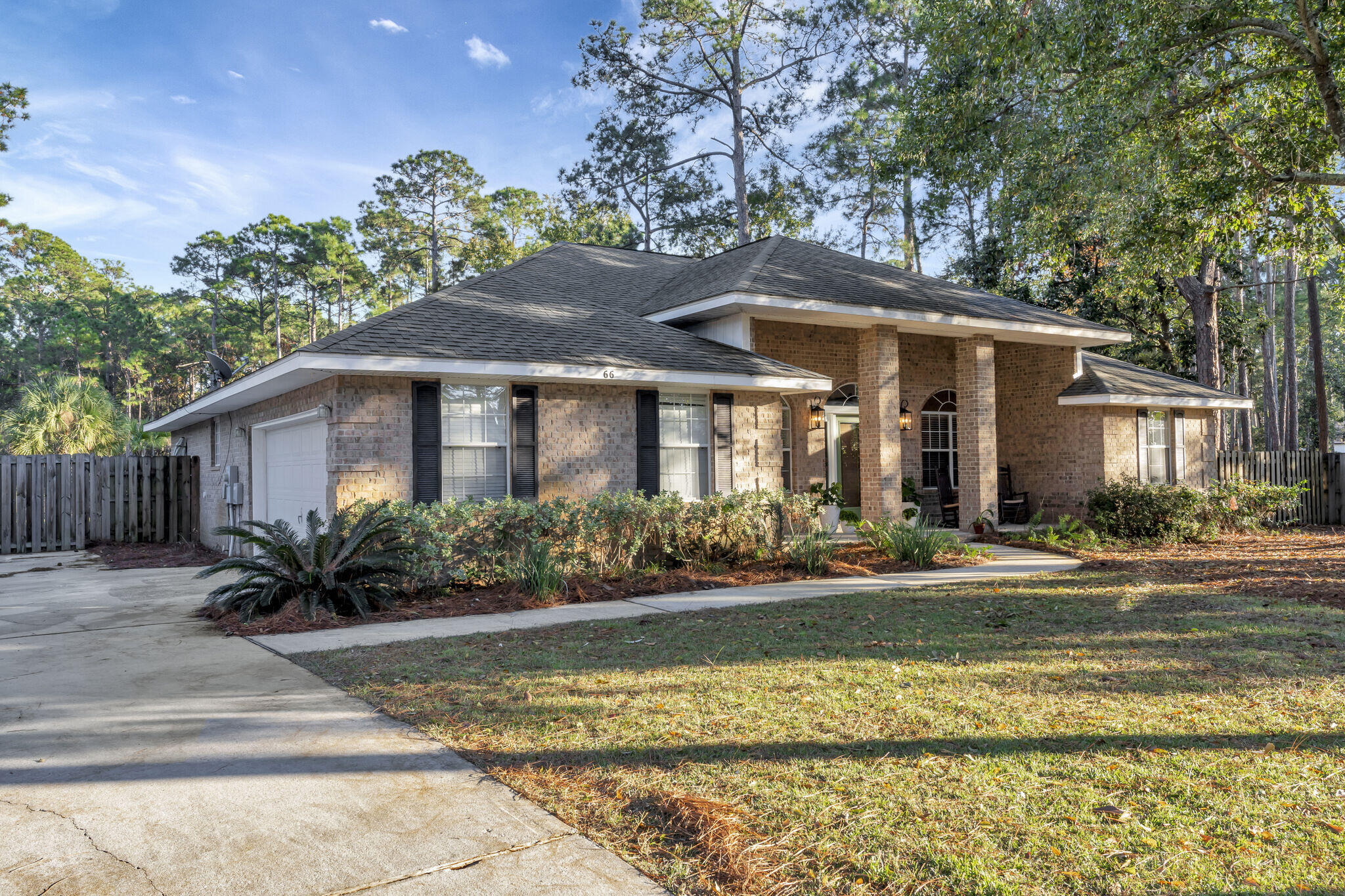 66 Driftwood Point Road Santa Rosa Beach, FL 32459 - Photo 2 of 72 a front view of a house with a yard