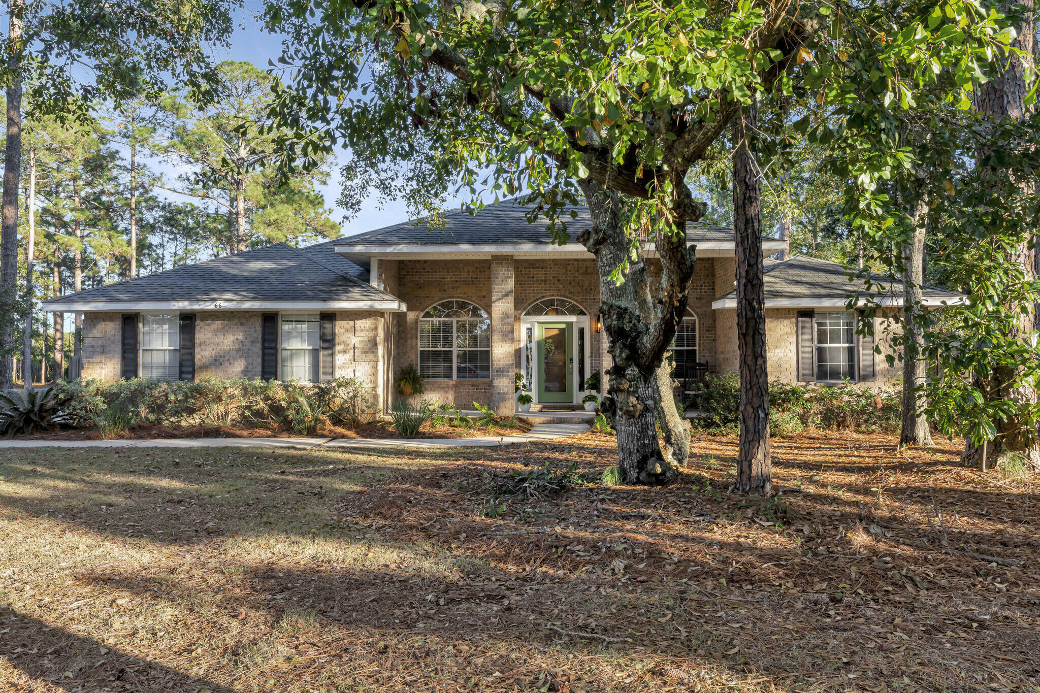 66 Driftwood Point Road Santa Rosa Beach, FL 32459 - Photo 3 of 72 a front view of a house with a yard