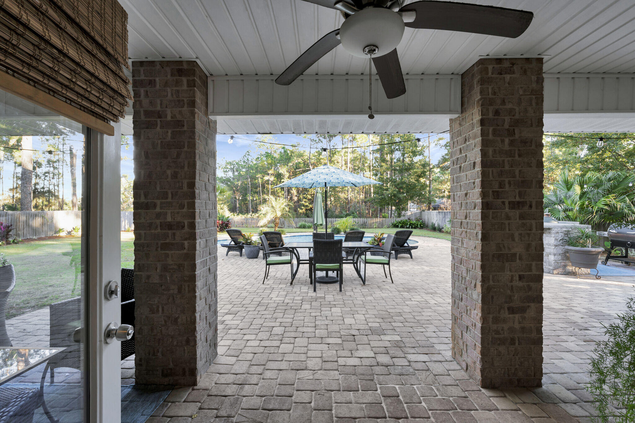 66 Driftwood Point Road Santa Rosa Beach, FL 32459 - Photo 38 of 72 a view of a patio with a dining table and chairs