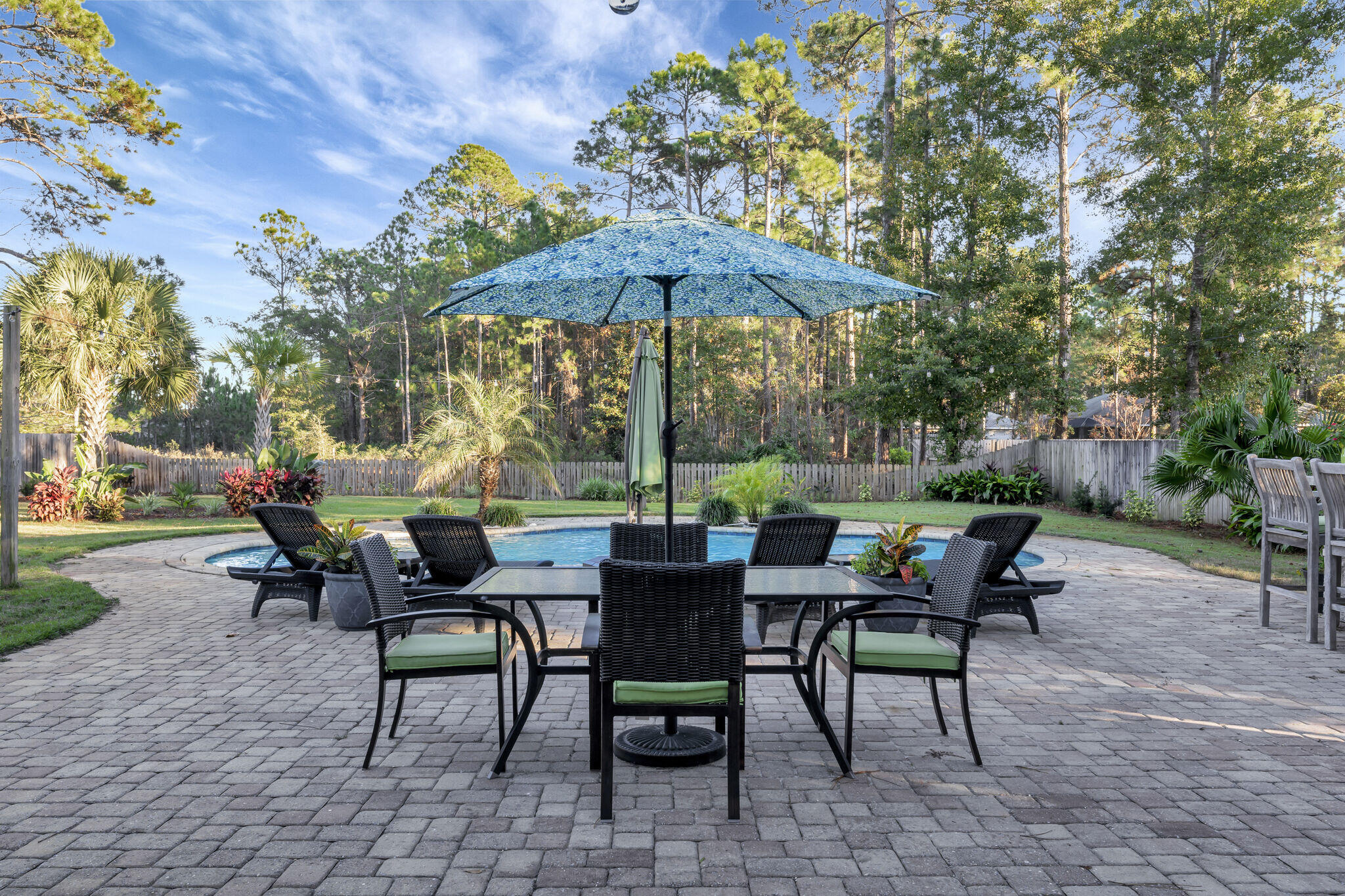 66 Driftwood Point Road Santa Rosa Beach, FL 32459 - Photo 42 of 72 a view of a tables and chairs in a patio