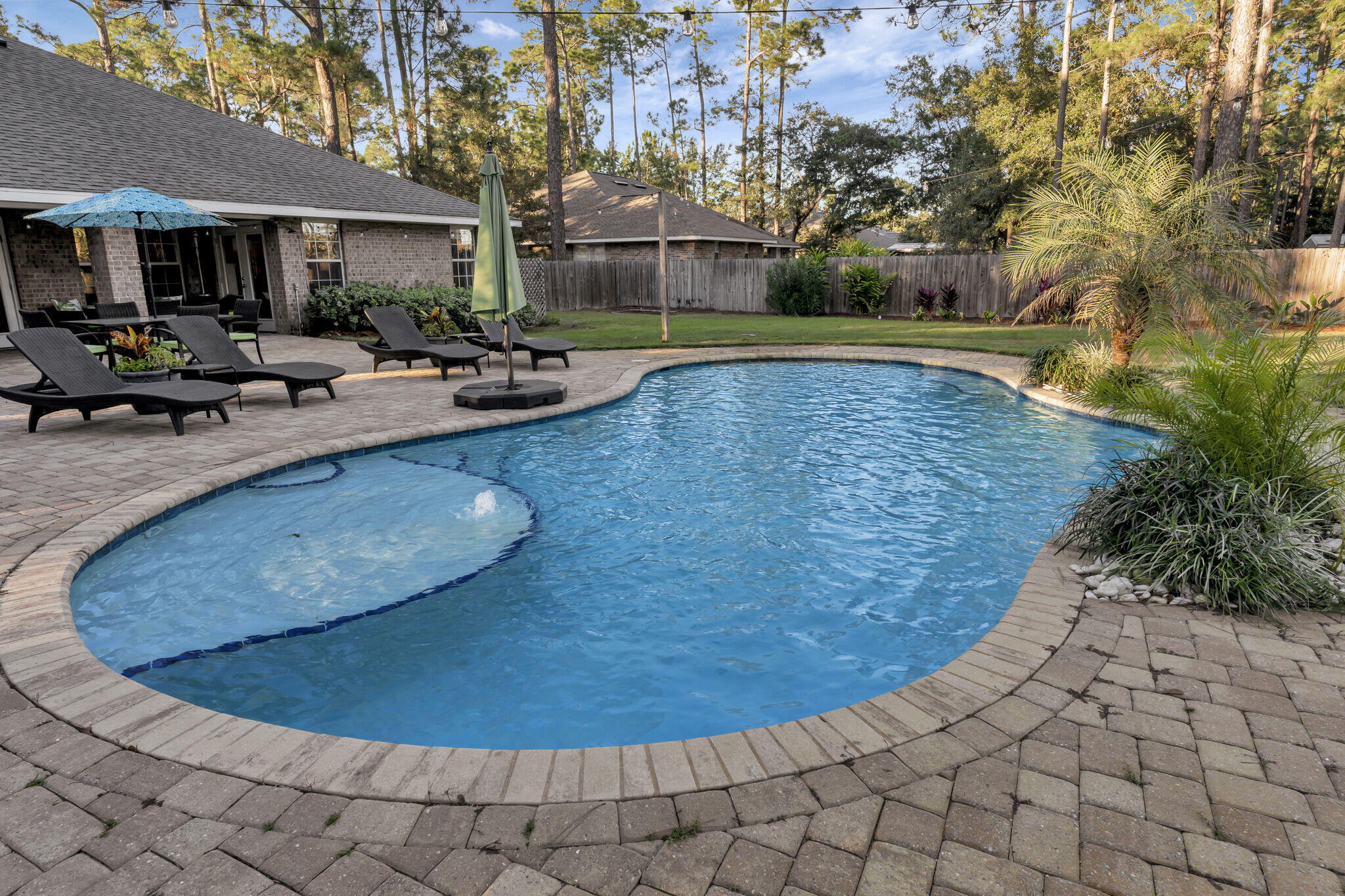 66 Driftwood Point Road Santa Rosa Beach, FL 32459 - Photo 46 of 72 a view of a swimming pool with lounge chair