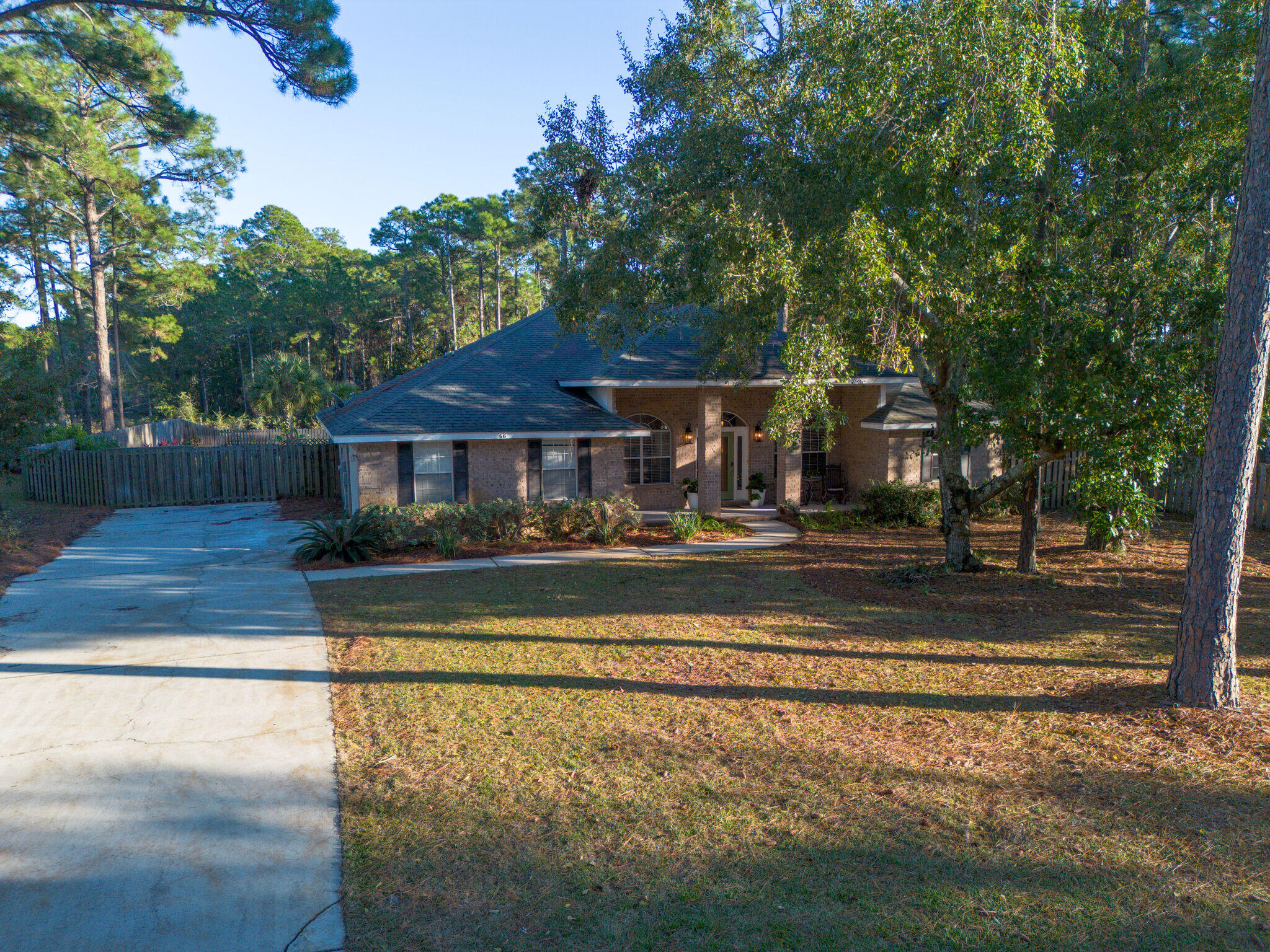 66 Driftwood Point Road Santa Rosa Beach, FL 32459 - Photo 52 of 72 a front view of a house with a yard