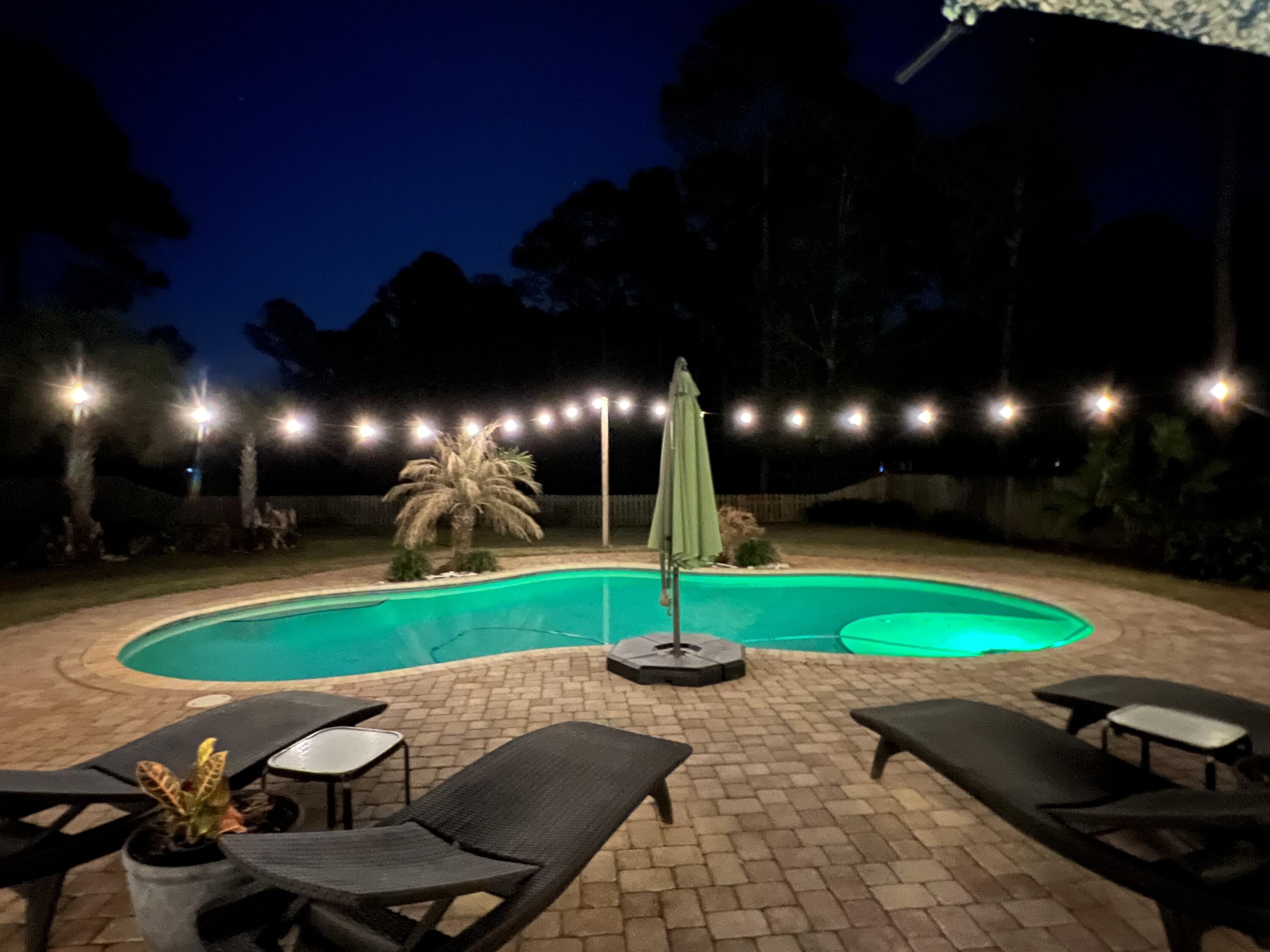 66 Driftwood Point Road Santa Rosa Beach, FL 32459 - Photo 70 of 72 Back yard green pol night