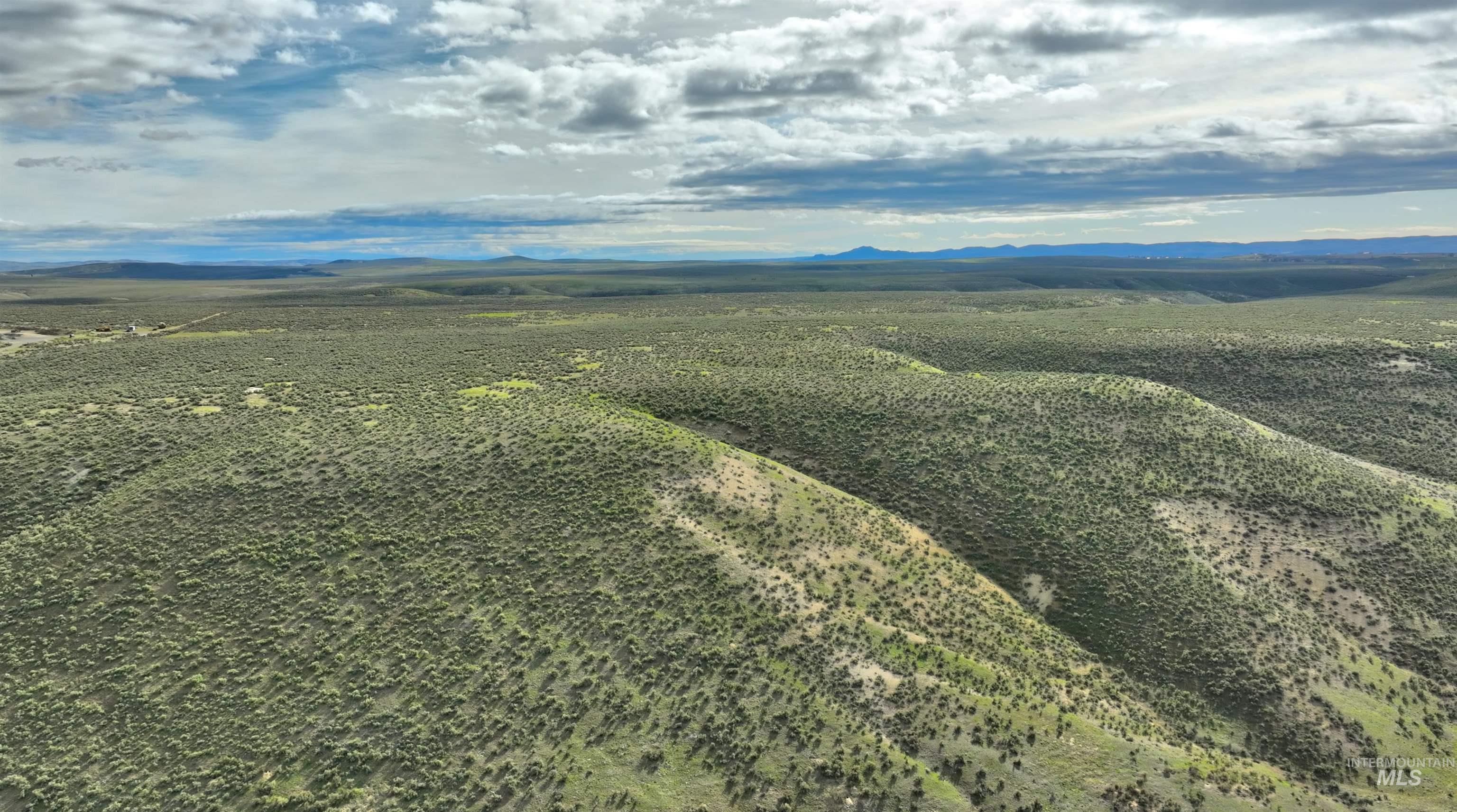 Tbd Bully Creek Road Vale, OR 97918 - Photo 9 of 16 Aerial view of sparsely populated area with a mountain backdrop