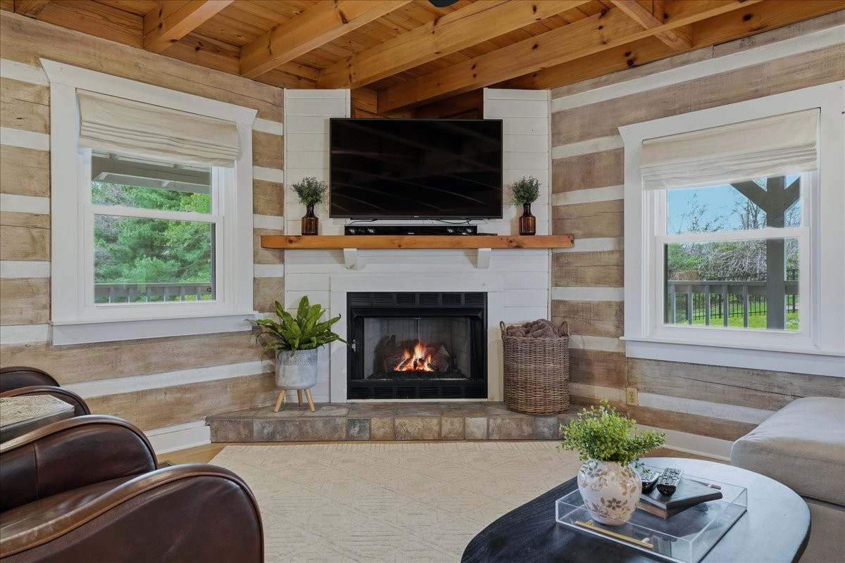 2254 Osburn Road Arrington, TN 37014 - Photo 11 of 55 a living room with furniture a flat screen tv and a fireplace