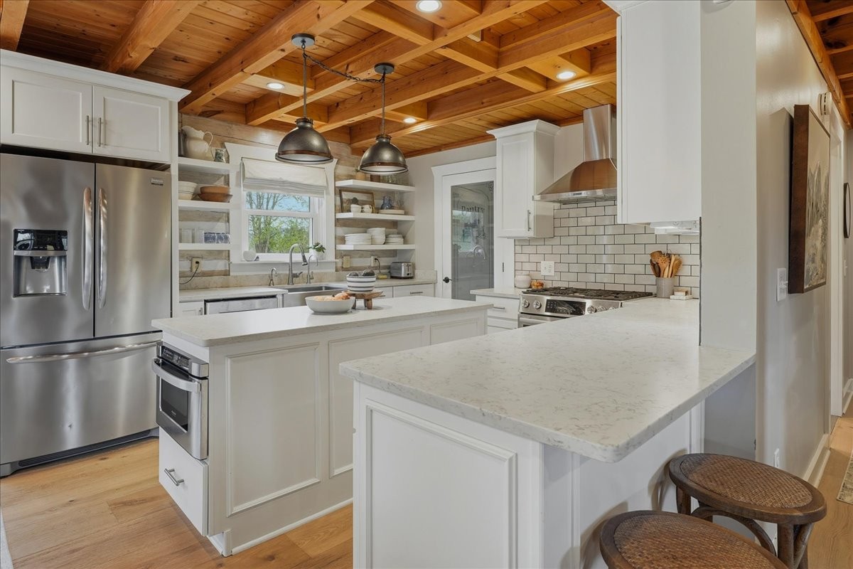 2254 Osburn Road Arrington, TN 37014 - Photo 12 of 55 a kitchen with a sink a refrigerator and cabinets