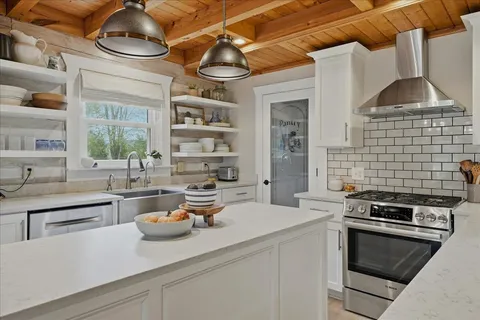 a kitchen with a stove and cabinets