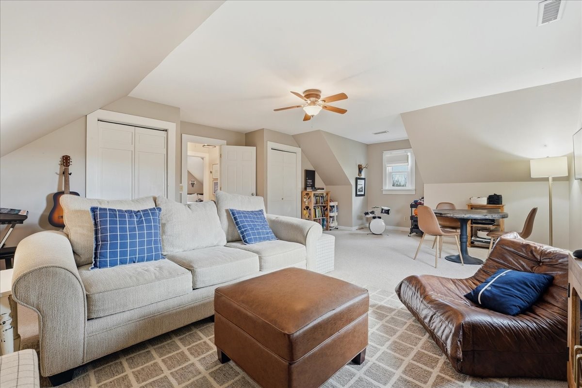 2254 Osburn Road Arrington, TN 37014 - Photo 27 of 55 a living room with furniture a rug and a chandelier